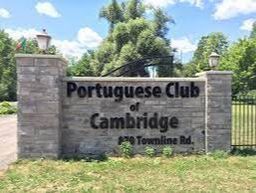 Grey stone block with black lettering spelling Portuguese Club of Cambridge, in Fiddlesticks, Cambridge, Ontario