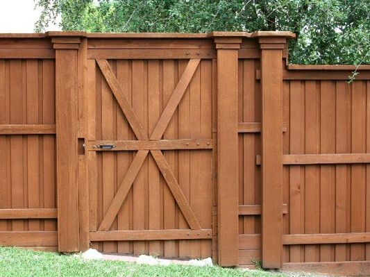 section of a medium brown gate and fence in Cambridge, Ontario